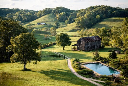 Rural scene depicts a weathered barn, pool, and path amidst rolling hills, bathed in soft sunlight, surrounded by lush greenery and distant structures