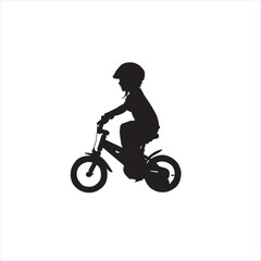 the boy is riding a bicycle