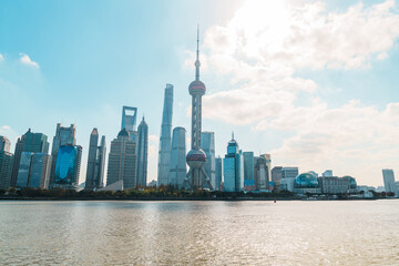 Obraz premium Cityscape view of Shanghai city in the morning. Skyscraper of Lujiazui in Pudong, view from The north Bund of Shanghai, China. landmark and popular for tourism attractions. Travel and Vacation concept