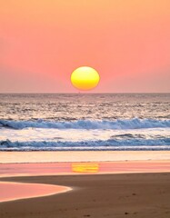 Obraz premium A serene seascape showcases a vibrant sun setting over gentle waves reflecting on the wet sand of a golden beach at twilight