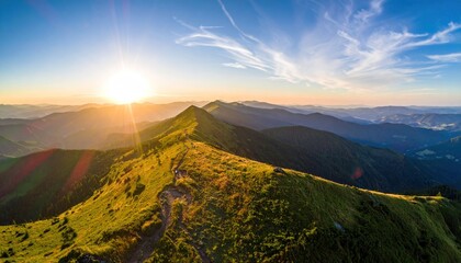 Mountain ridge bathed in golden sunlight under a blue sky streaked with wispy clouds, showcasing a vast and scenic landscape