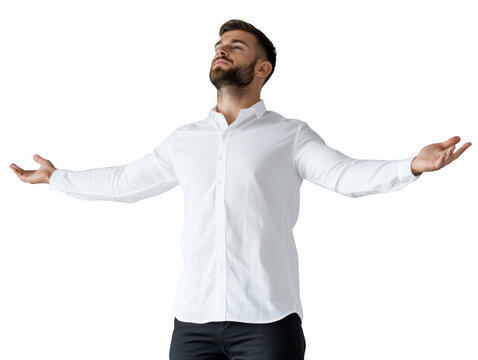 Man in white shirt with arms outstretched looking up against a black background in a studio setting