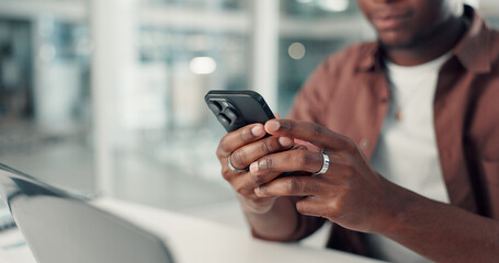 Phone, hands and black man in office with networking, communication or contact on mobile app. Typing, technology and African male creative director with chatting, online and cellphone in workplace.