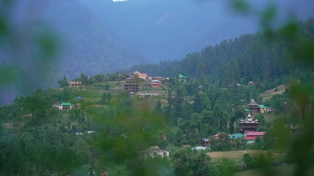Small villages with colorful local houses nestled in the hills of Parvati Valley at Manikaran, Himachal Pradesh, India.