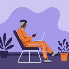 Relaxed senior Black man engages with laptop and smartphone, illustrating remote work, digital communication, and an active modern lifestyle.