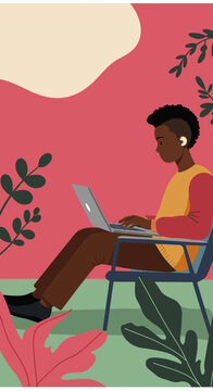 Young woman in a cozy jacket working on a laptop in an armchair, depicting remote work, freelance, or online learning.