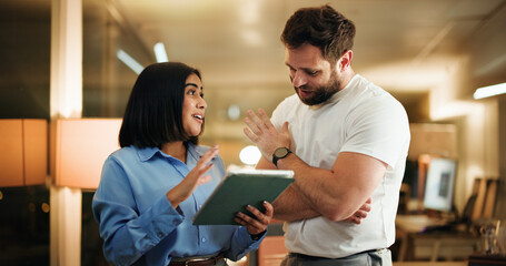Business, night and people with tablet, conversation and teamwork with financial agency. Overtime, man and woman in office, tech and discussion with feedback for trading report, planning and investor