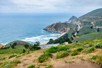 Scenic view of Highway 1 coastline from Gray Whale Cove Trail near Pacifica, California, with ocean...