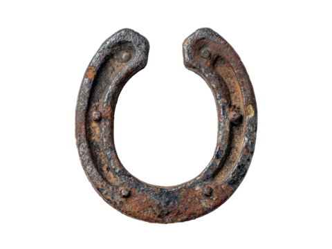 Rusty metal horseshoe with nail holes isolated on black iron antique