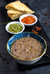 Jareesh, a traditional Saudi Arabian dish of coarsely ground wheat (or cracked wheat) cooked with yogurt, meat (like chicken or lamb), and spices, creating a thick, creamy, porridge-like consistency