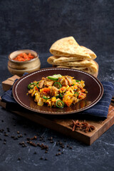 Laham Mugalgal, a dish of minced goat meat typical of the Middle East, especially Saudi Arabia, which is sauteed with spices and vegetables such as tomatoes, onions, peppers, served with khobus bread