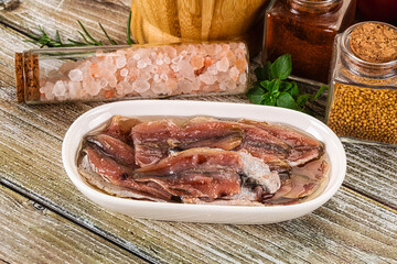 Canned anchovy with oil in the bowl