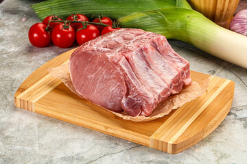Raw pork loin cut with bone