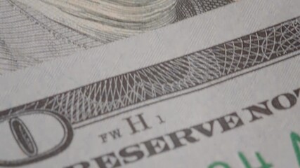The video showcases the intricate details of a dollar banknote, examining its unique features, security elements, and the significance of Janet L. Yellen's signature.