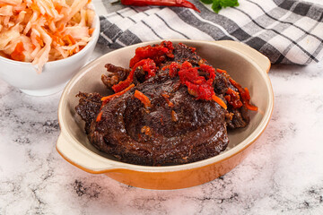 Baked beef cheeks with vegetables