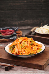 Fresh Korean Kimchi Traditional Fermented Vegetable Dish with Chili Peppers on Wooden Table