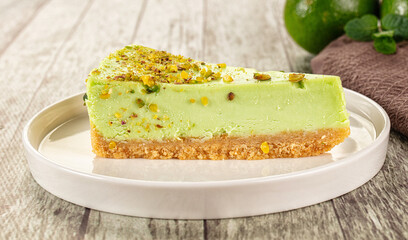 Green pistachio cheesecake served mint