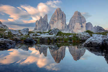 Reflection of Tre Cime di Lavaredo and Amazing Clouds in the Lake