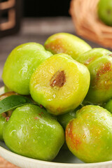 Fresh Green Xinjiang Pears with Water Droplets in Wooden Bowl - Natural Organic Fruit