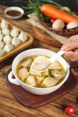 Handmade Pork Dumplings in Clear Broth with Fresh Vegetables Traditional Asian Cuisine