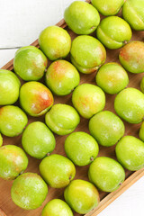 Fresh Green Pears with Red Blush on Wooden Board - Organic Fruit Display