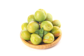 Fresh Green Apricots from Xinjiang in Wooden Bowl with Mint Leaf