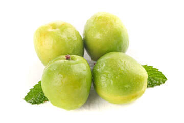 Fresh Green Plums with Water Drops and Mint Leaves Isolated on White Background