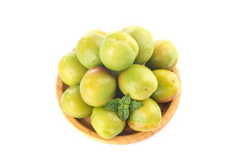 Fresh Green Apricots or Pears in Wooden Bowl with Mint Garnish on White Background