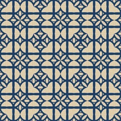 Seamless pattern of ceramic mosaic tiles with a geometric ornament and floral decoration