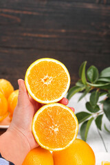 Fresh Navel Orange Slices in Hand - Healthy Citrus Fruit Gift Box Concept