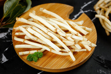 Fresh Bamboo Shoots with Tender Nodes on Wooden Board - Asian Vegetable Cooking Ingredient