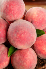 Fresh Red Peaches with Green Leaves - Ripe Fruit Harvest Display