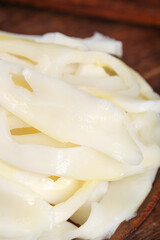 Fresh White Asparagus Spears Peeled and Ready for Cooking on Wooden Board