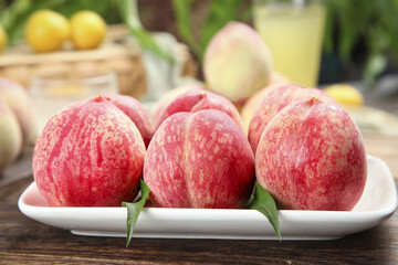 Freshly Picked Ripe Peaches on White Plate - Organic Summer Fruit Harvest Display