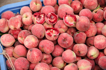 Fresh Red Blood Peaches from Hubei China in Market Basket Display