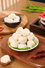 Hot Fresh Handmade Fish and Shrimp Balls with Asian Ingredients on Wooden Board