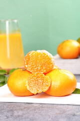 Fresh Seedless Tangerines from Chungcheon Korea with Peeled Segments and Orange Juice Glass