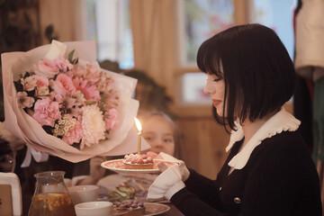 bouquet of flowers mom daughter and grandma family women's party in a cafe, Greetings to the family