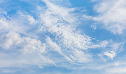 Fototapeta premium Wispy and Layered Clouds in the Bright Afternoon Sky