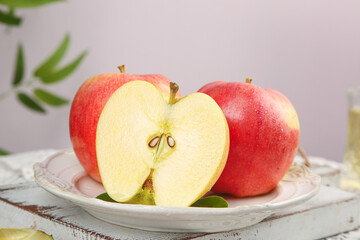 Fresh Red Gala Apples Cut in Half on White Plate - Healthy Organic Fruit Snack