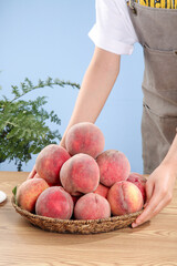 Fresh Red Peaches Direct from Hubei Orchard Supply in Wicker Basket with Farmer Hands