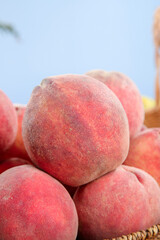 Freshly Picked Red Blood Peaches from Hubei China in Wicker Basket