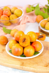 Fresh Xinjiang Apricots on Wooden Board - Ripe Orange Summer Fruit Display