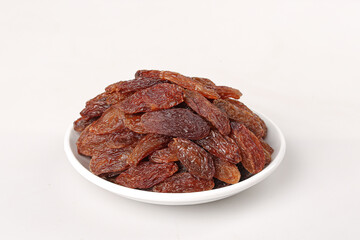 Xinjiang Raisins in White Bowl on Clean Background - Premium Dried Fruit Set