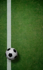 Soccer ball on green grass field with white line top down view football sports