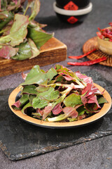 Freshly Dug Wild Fishweed Vegetables from Hubei - Seasonal Foraged Leaves on Wooden Plate
