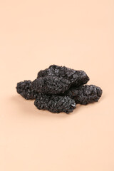 Black Dried Mulberries from Xinjiang - Wild Superfruit Snack on Neutral Background