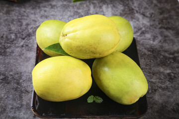 Fresh Yunnan Papaya Fruits on Wooden Board - Tropical Asian Fruit Harvest