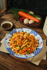 Cantonese Fried Rice Vermicelli Noodles with Fresh Vegetables on Traditional Chinese Plate