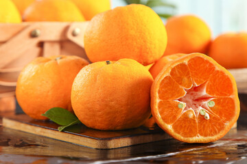 Fresh Orange Citrus Fruits on Wooden Cutting Board - Healthy Vitamin C Rich Food